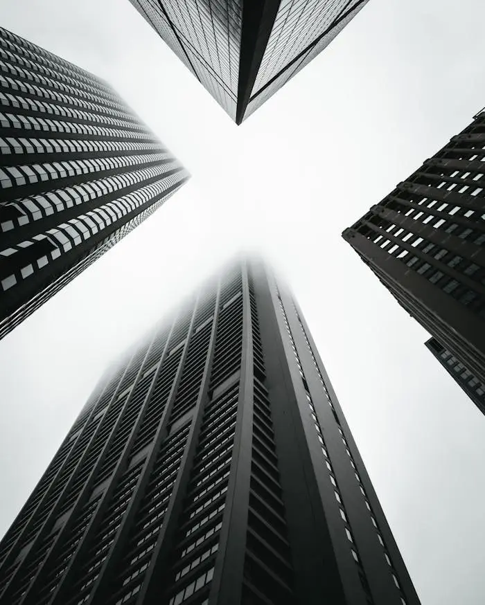 Dramatic low-angle shot of skyscrapers in Chicago creates a geometric urban scene.